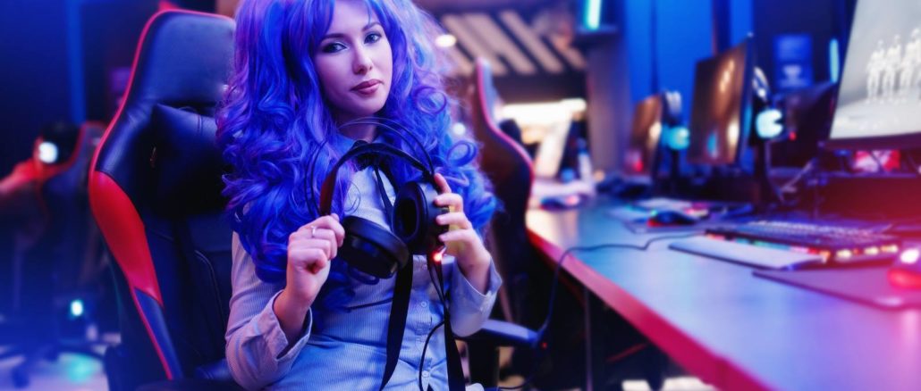 Young woman streamer anime cosplay professional gamer playing video online games computer